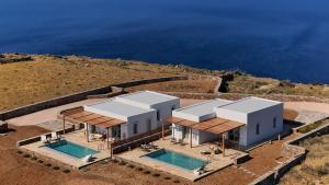 an aerial view of a house with two swimming pools at Didimos Luxury Villas in Cherronisos