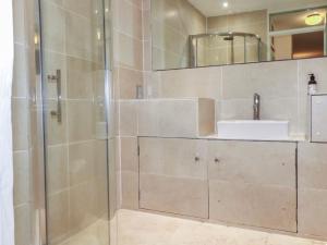 a bathroom with a shower and a sink at The lodge in Bodmin +18 photos