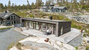 an aerial view of a house on a hill at Seaside Escape - 10 Min to Ocean in Ytre Søndeled