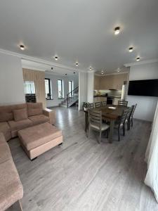 a large living room with a couch and a table at Mughni home in Ashtarak