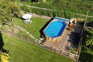 an overhead view of a swimming pool in a yard at 4 Bed in Burrowbridge oc-o33020 in Athelney