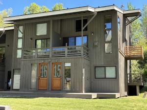 a large house with a porch and a balcony at Mountain Magic in Ketchum