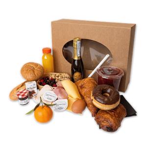 a box filled with different types of bread and donuts at De Strandgaper Egmond in Egmond aan den Hoef +14 photos