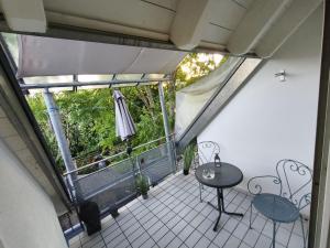 an empty balcony with a table and chairs on it at Harbour Apartment in Moos