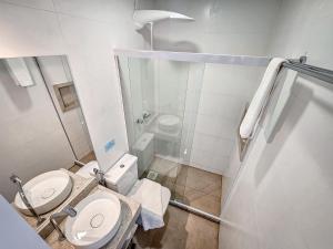 a small bathroom with a toilet and a shower at Sofia's on the Beach in Búzios +133 photos