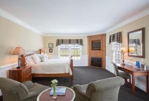 a bedroom with a bed and a table and chairs at Smithfield Station in Smithfield +37 photos