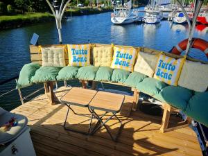 a couch on a boat in the water at bateau nuit insolite in Carentan