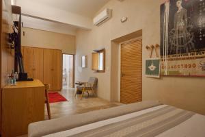 a room with a bed and a desk and a chair at Casa Carmen Morelos in Oaxaca City +116 photos
