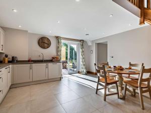 a kitchen and dining room with a table and chairs at 2 Bed in Stoke-on-trent oc-95164 in Longton