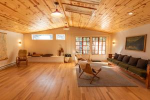 a living room with a couch and a table at Captain Whidbey in Coupeville