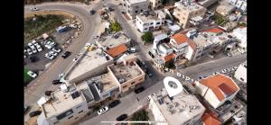 an overhead view of a city street with buildings at 8kmלחרמון in Majdal Shams