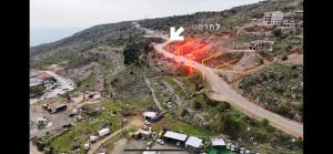 an aerial view of a road on a mountain at 8kmלחרמון in Majdal Shams +1 photo