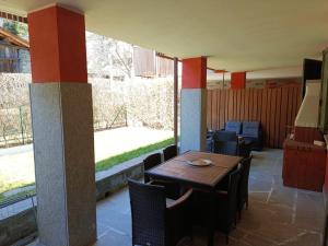 a dining room with a table and some chairs at Bernina House in Chiesa in Valmalenco