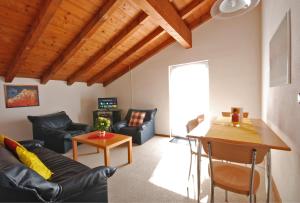 a living room with a couch and a table at Casa Esmeralda in San Nazzaro +17 photos