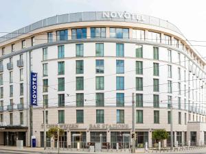 a large white building with a sign on it at Novotel Nürnberg Centre Ville in Nuremberg