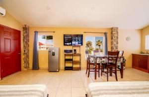 a kitchen and dining room with a table and chairs at Beach Studio 7 in San Felipe