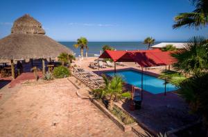 a resort with a swimming pool and a beach at Beach Studio 7 in San Felipe