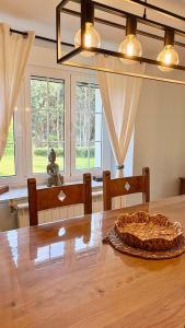 a dining room table with a pie on top of it at The Cliffs - Casa Cadaval in Santa Marta de Ortigueira