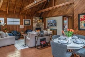 a living room with a table and a fireplace at 3796 The Madden Suite in Carmel