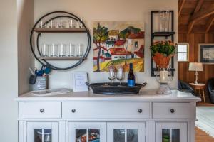a white dresser with a mirror on top of it at 3796 The Madden Suite in Carmel +27 photos