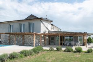 a house with a pool in front of it at Pepi Sobe in Čepin