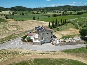 an aerial view of a house on a road at Casa Al Vento in Lucignano