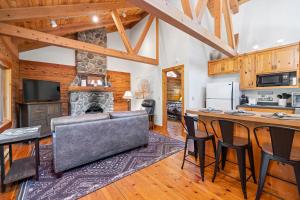 a kitchen and living room with a table and a couch at 2 Riverfront Cabins, 200 Acres Near Plumas Forest in Sloat +33 photos