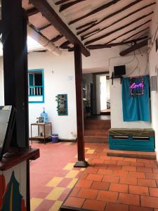 a room with a wall with a blue banner on it at The Best Adventure Hostel in San Gil
