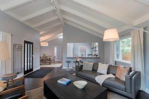 a living room with a couch and a table at 3890 Cypress Rest in Pebble Beach