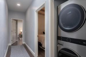 a room with a washing machine on the wall at 3890 Cypress Rest in Pebble Beach
