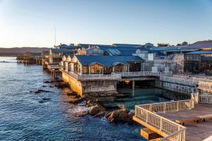 a group of buildings next to a body of water at 3890 Cypress Rest in Pebble Beach