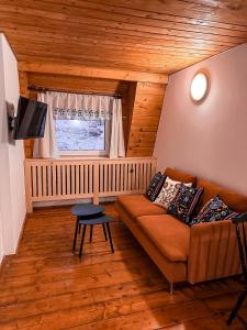 a living room with a couch and a window at Siedlisko u Jana in Korbielów