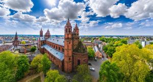 an aerial view of an old building with a tower at Worms City Suites Löwengasse in Worms