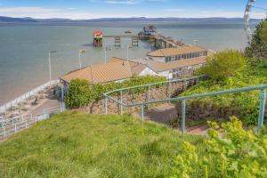 an aerial view of a pier on the water at 2 Bed in Mumbles oc-hh505 in The Mumbles