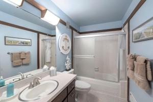 a bathroom with a sink and a toilet and a shower at 3823 Sand Dollar House in Moss Landing +25 photos