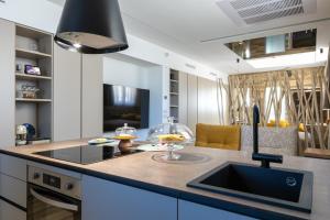 a kitchen with a sink and a counter top at Suite spa civico 4 in Follonica