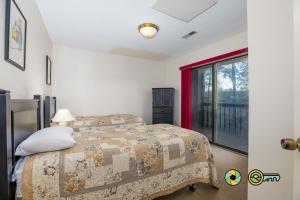 a bedroom with a bed and a window at Senedo Springs Duplex #90B in Basye +28 photos