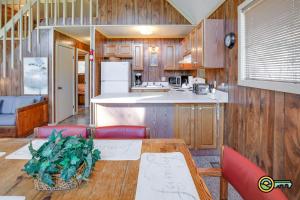 a kitchen and dining room with a table and chairs at Villa #8 in Basye