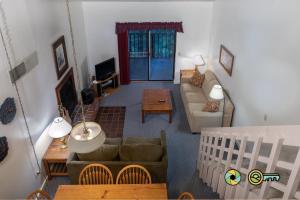 a living room with a couch and a table at Senedo Springs Condo #2-301 in Basye