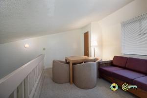 a living room with a couch and a table at Senedo Springs Condo #2-301 in Basye
