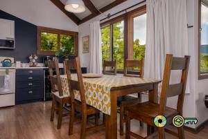 a kitchen and dining room with a table and chairs at The Hill T-19: Eagle's Nest in Basye