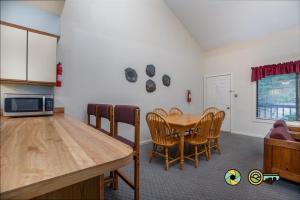a kitchen and dining room with a table and chairs at Senedo Springs Duplex #90A in Basye +28 photos
