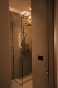 a shower with a glass door in a bathroom at SD Guest Villa in Krujë +48 photos