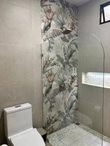 a bathroom with a shower and a toilet in it at Casa Melda Walk to the Beach & Gandoca-ManzanillO in Manzanillo