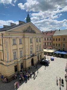 a group of people standing in front of a building at Lublin Aura Residence in Lublin