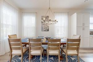 a dining room with a table and chairs at New-Build with Pool Walk to Beach in Santa Rosa Beach +22 photos