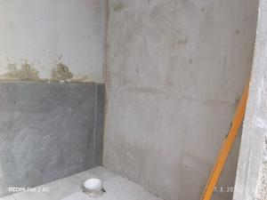 a corner of a room with a concrete wall at Kamp Suad in Bihać