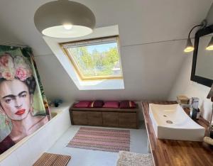a bathroom with a sink and a window at Chez Billie et Moon in Landéda +12 photos