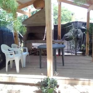 a patio with a table and chairs on it at Amor pisciano 1 in Salinas +6 photos