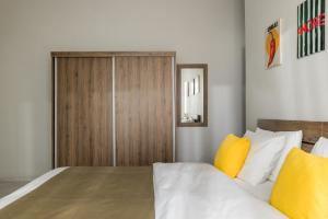 a bedroom with a bed and a wooden cabinet at Sakis in Polychrono